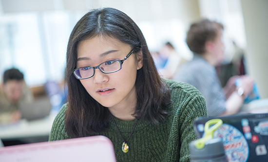 Female student working on a laptop