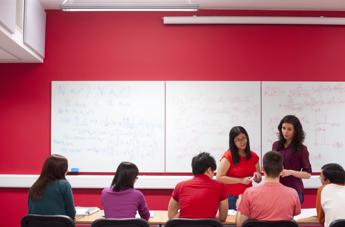 Image of students working together in a classroom