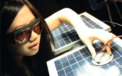 A student working on a solar panel
