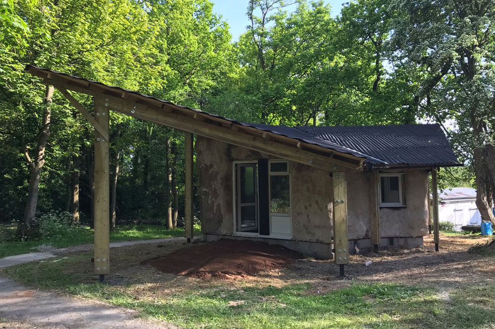 A building surrounded by trees and grass.