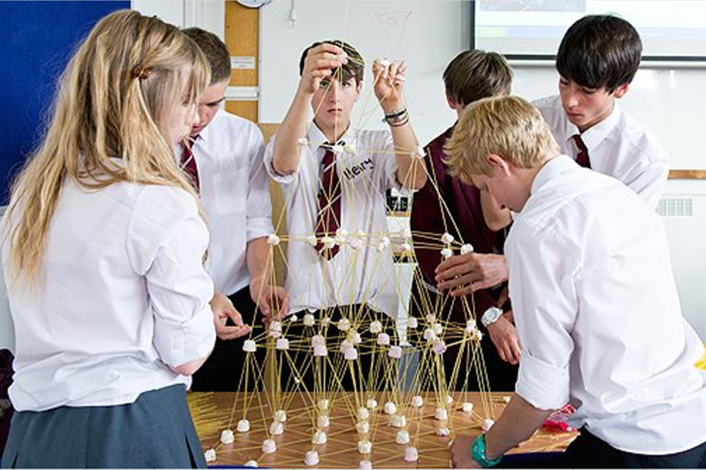 Student's building with spaghetti