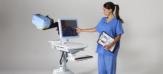 A medical professional using a burns scanner