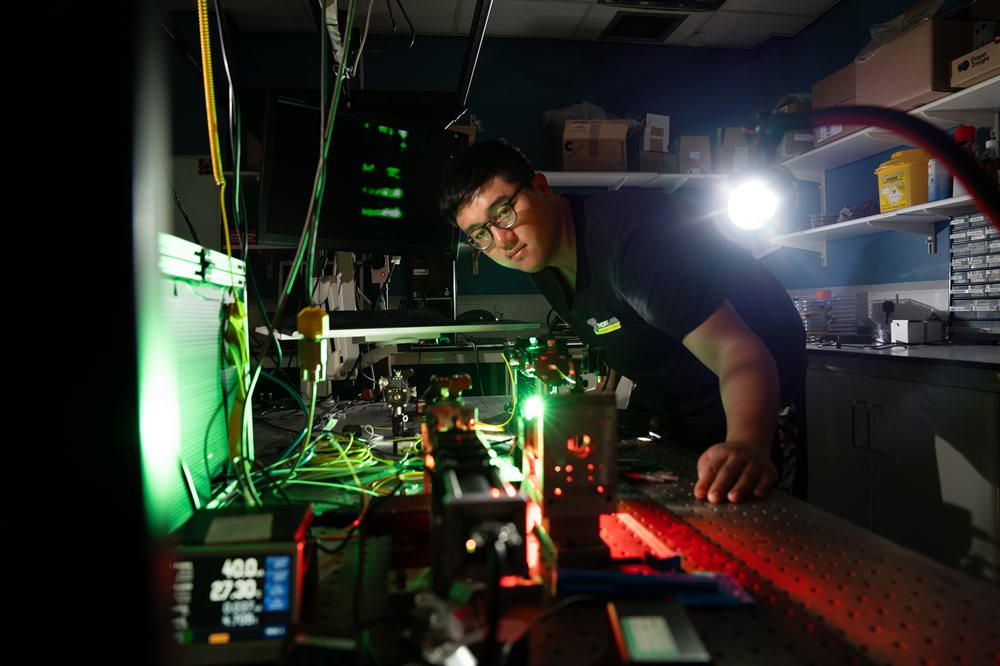 An engineering PhD student using an optical fibre imaging system