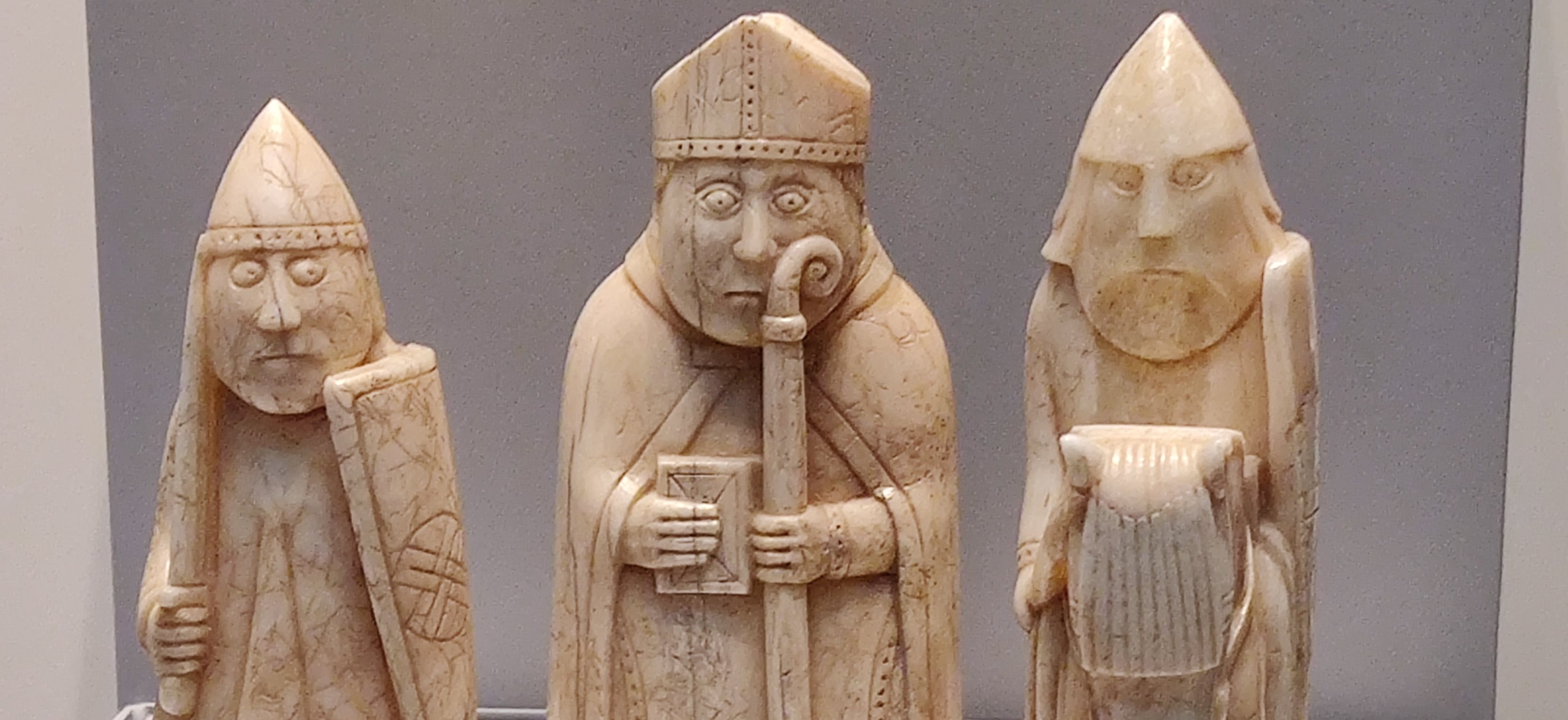 Lewis Chessmen with a bishop, a rook and a knight shown.