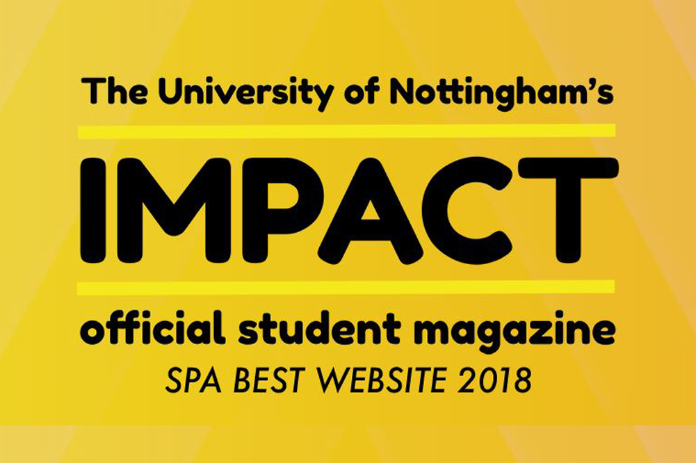 Two students working in the Impact magazine office