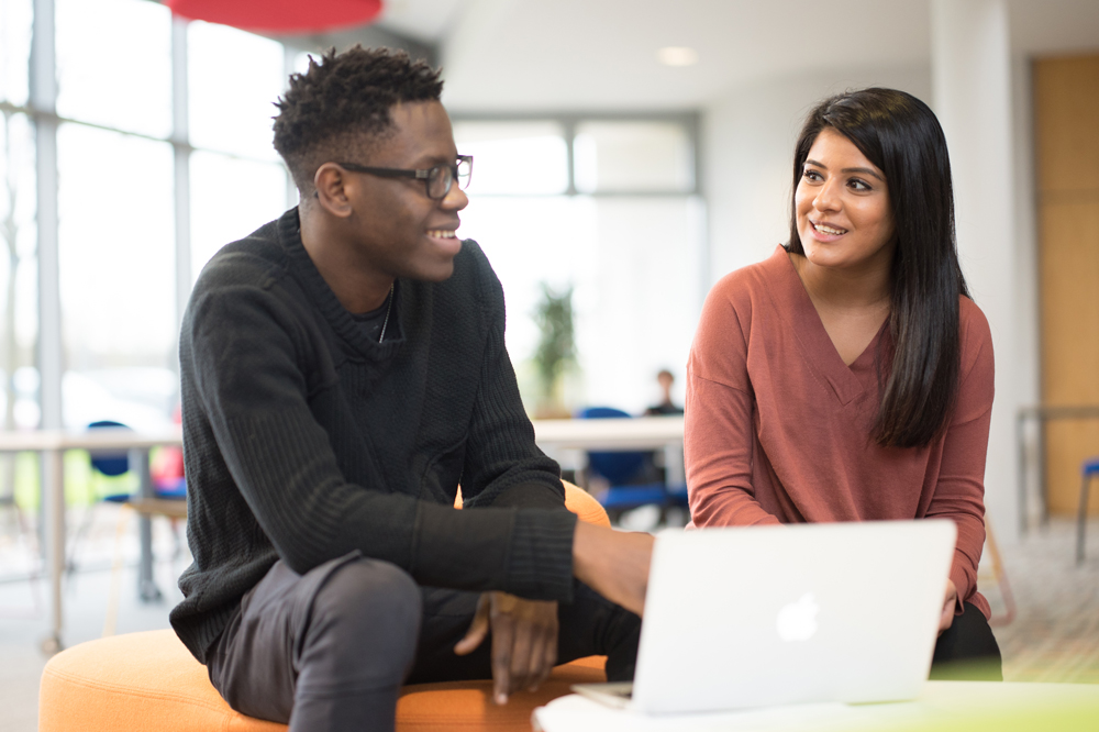 Two students catching up in a peer mentor meeting