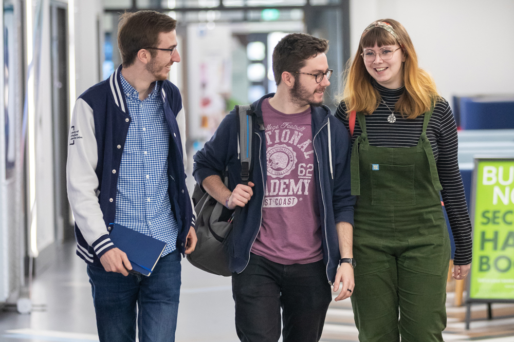 A group of students walking through Portland Building