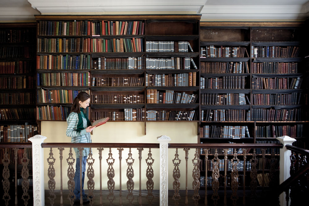 A female student on placement at Bromley House Library