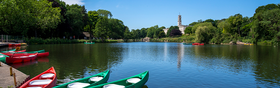 boats on the lake in front of Trent building