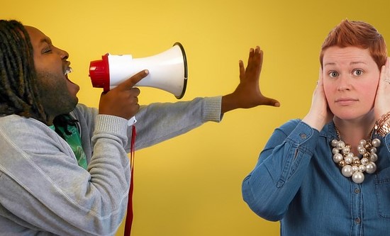 A person being yelled at with a loudspeaker