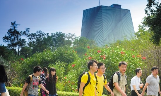 Undergraduate and postgraduate students walking in front of the CSET building - Ningbo Campus, China