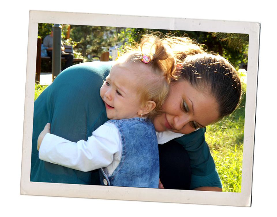 Toddler hugging it's mother