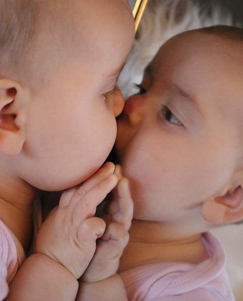 Babies face with red dot on nose