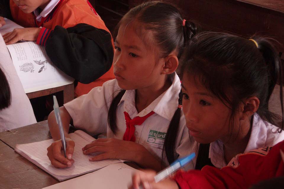 Two girls studying at a school desk
