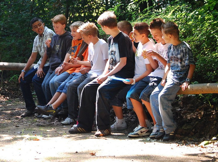 a gathering of boys around 13 to 14 years of age.