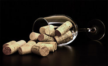 Alcohol linked image of glass containing corks