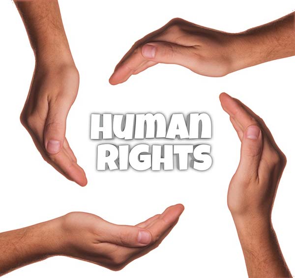 A graphic of four hands surrounding the title 'Human Rights'.