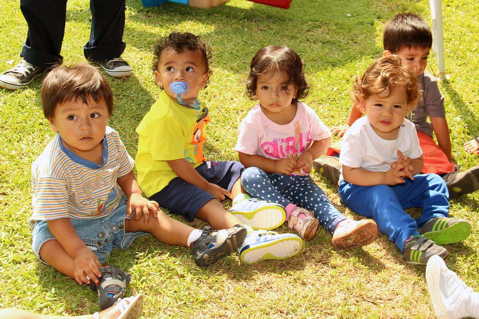 Group of children sitting on grass