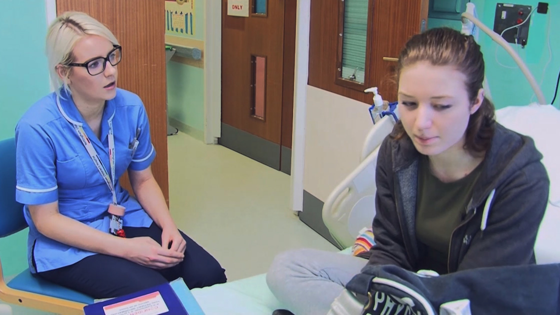 Nurse and child or young person having a discussion