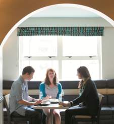 Conversation indoors around a quiet table