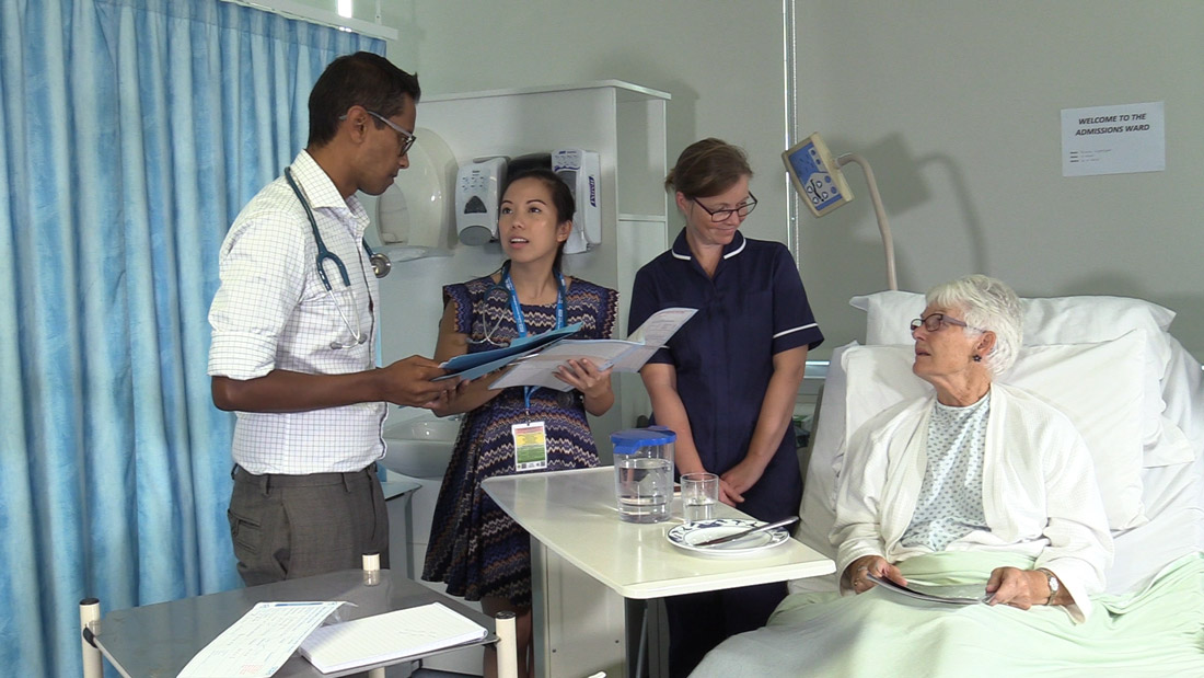 Florence in the admissions ward with Doctors and nurse during a ward round