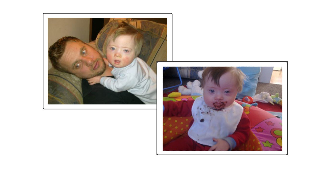 a picture of a Father cuddling his infant child and baby with food on face.