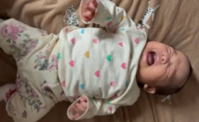 Baby crying making agitated movements