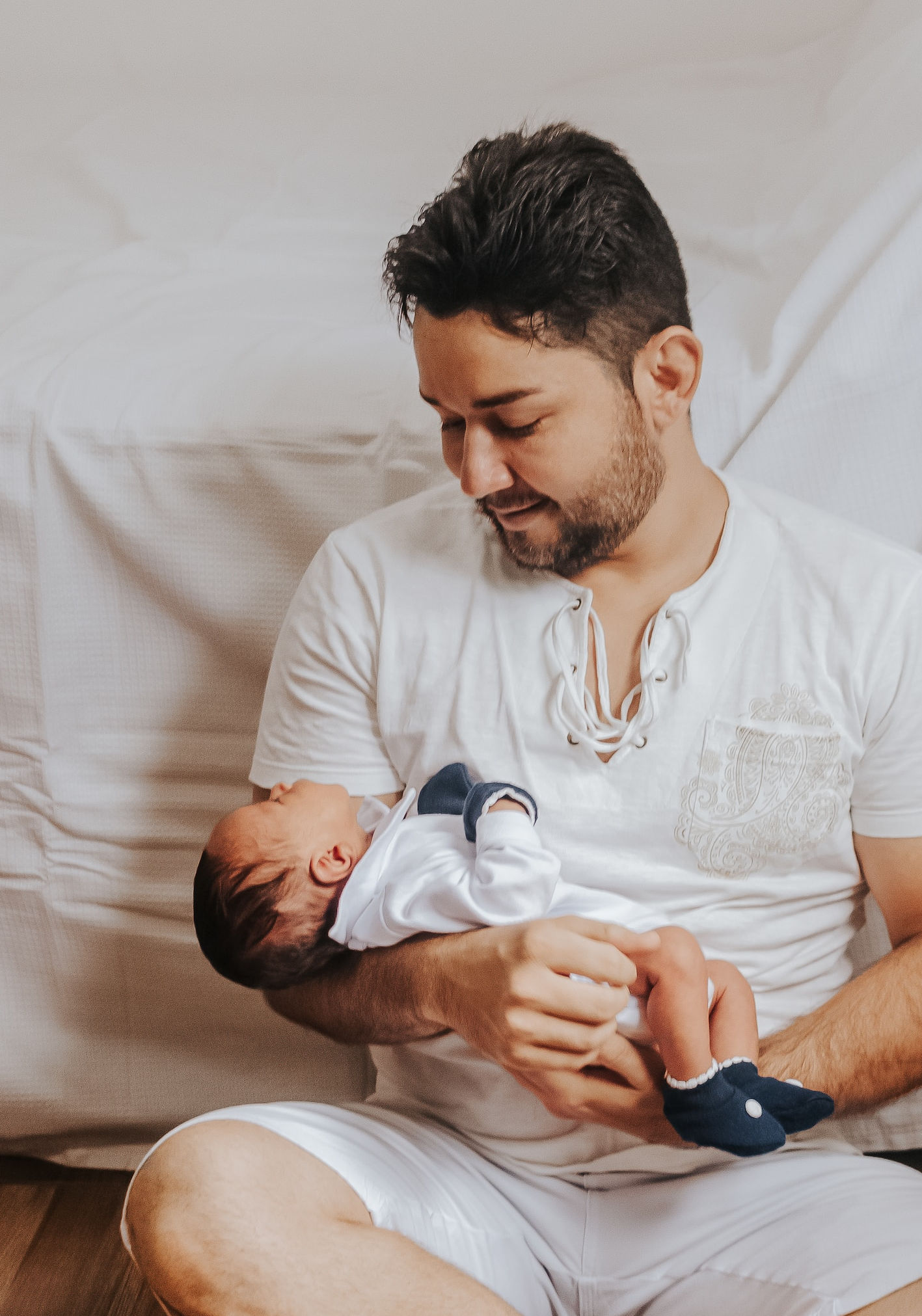 Father holding their young baby