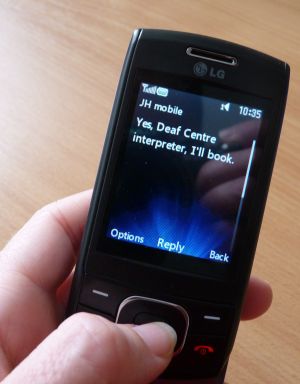 Photo of mobile phone with text message.