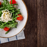 Image of a salad containing rocket leaves
