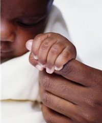 baby holding finger