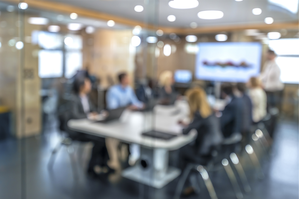 Group of people around a meeting table