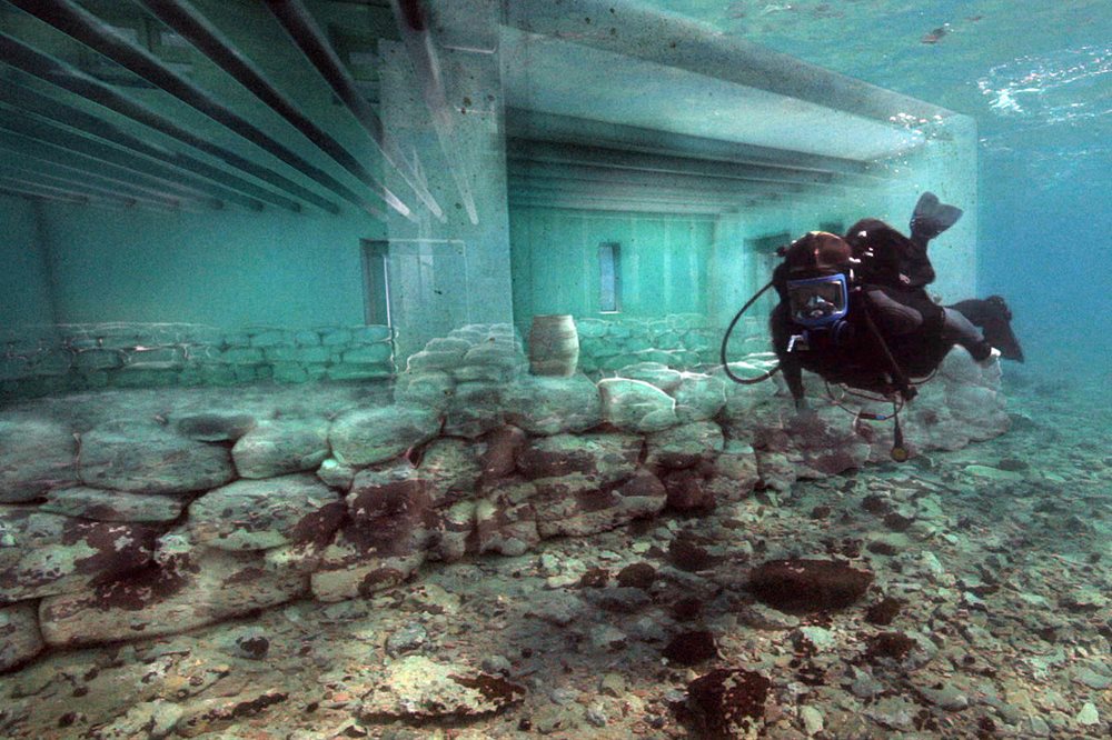 Diver underwater in ruins of Pavlopetri