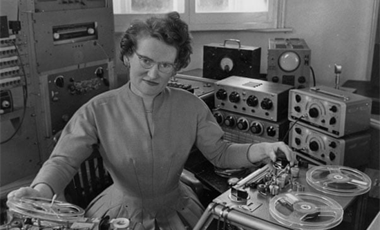 Black and white image of Daphne Oram in her music studio in 1962