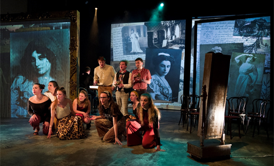 Singers in front of projected images performing Losing her Voice opera