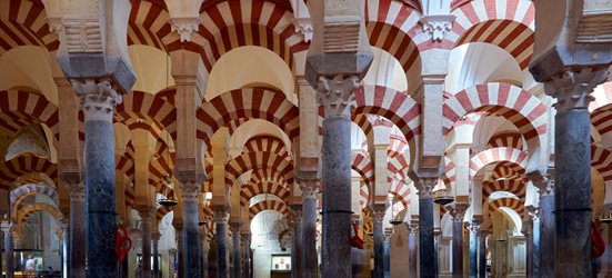 Inside of Cordoba cathedral showing repetitive mosque arches