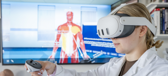Student exploring a model of the human body using a VR headset