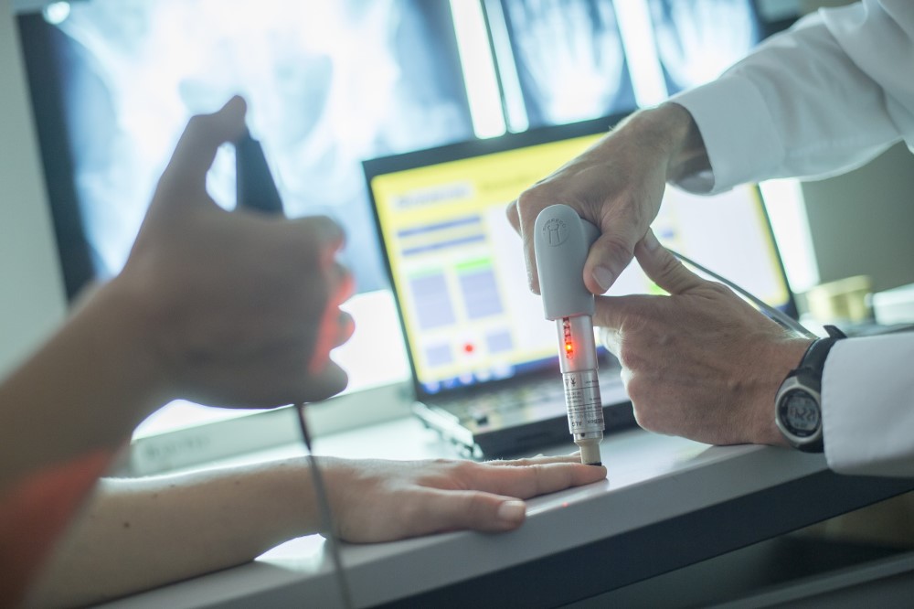 Academic conducting a medical test on a patient