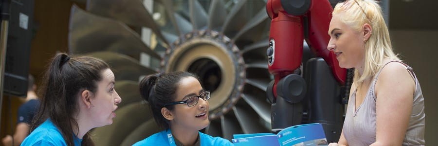 Staff helpers assisting a visitor on an open day