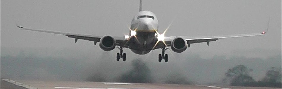 A plane landing on a runway at East Midlands Airport
