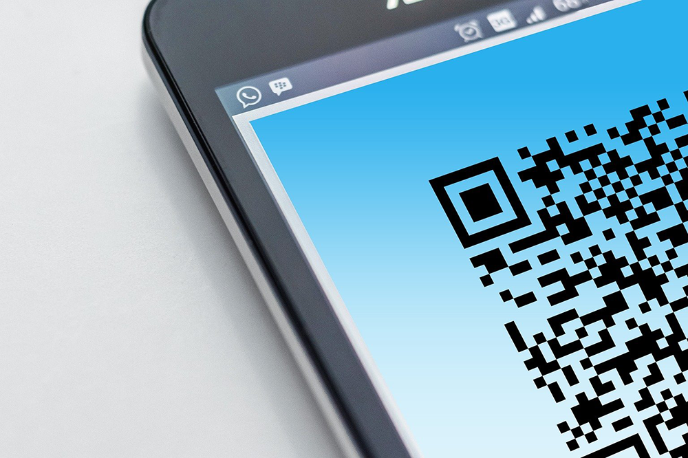 Close up of a QR code on a mobile phone screen