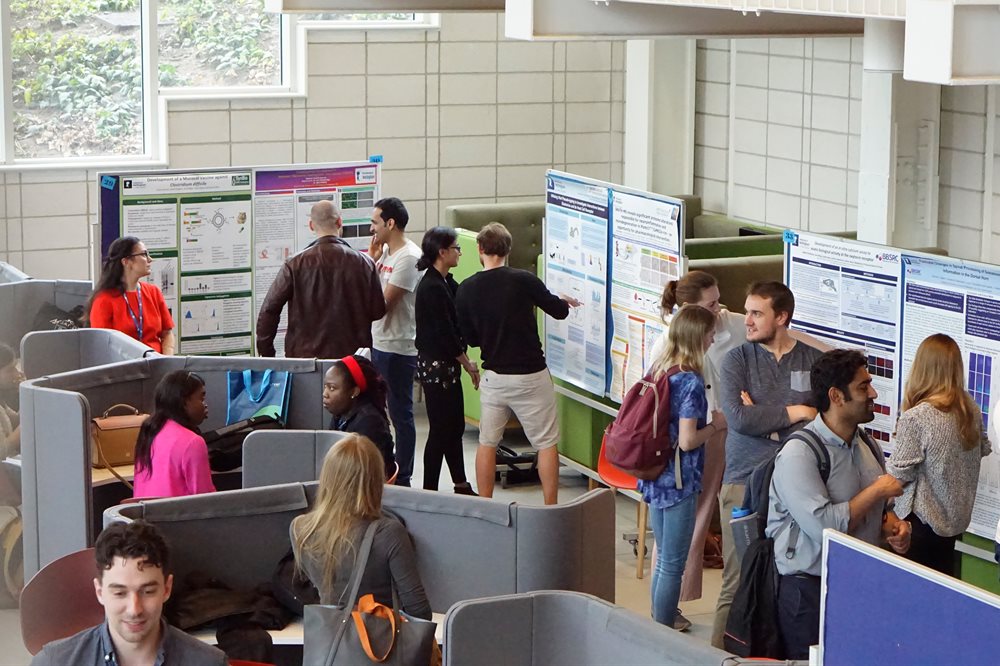 Students giving posters presentation in the Teaching & Learning building atrium