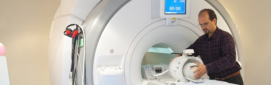 Researcher configuring an MRI scanner