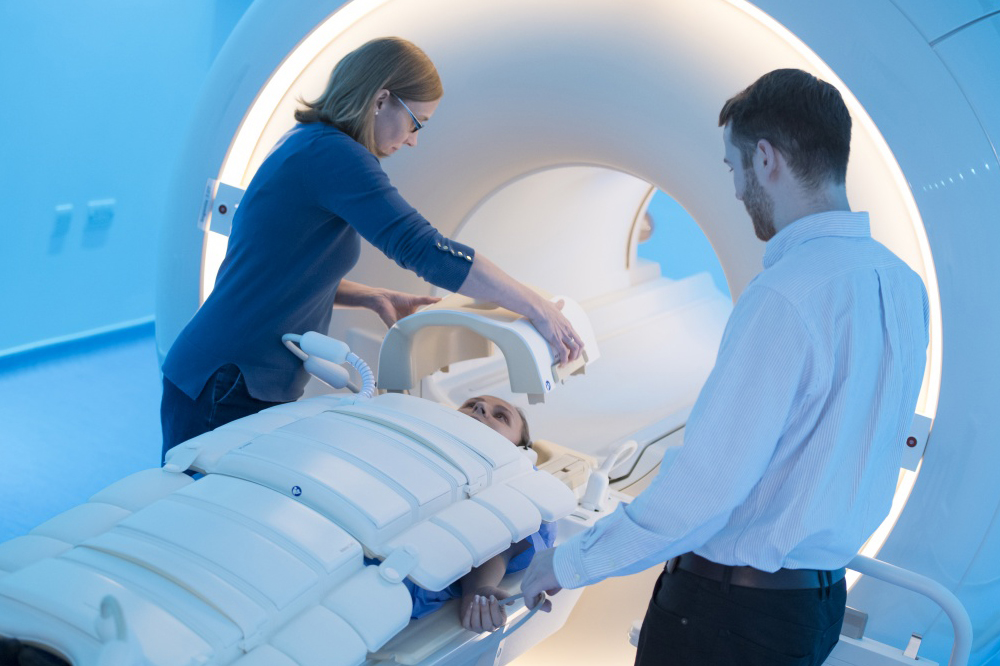A person being placed into an MRI machine