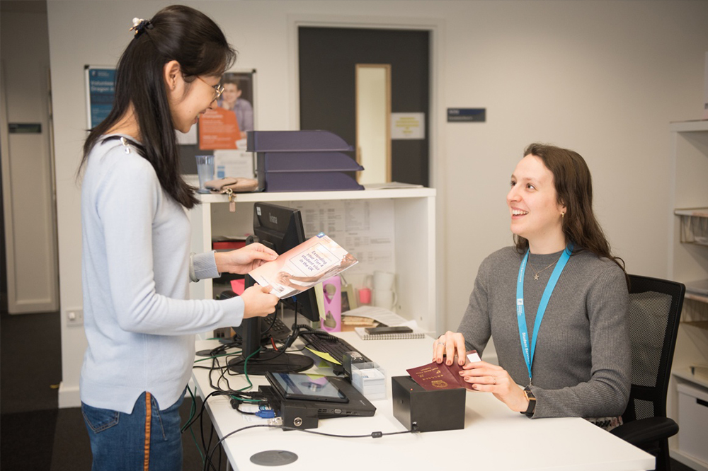 Student speaking to a member of the Student Services Team