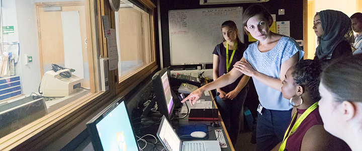 Summer school students being taught by a lecturer