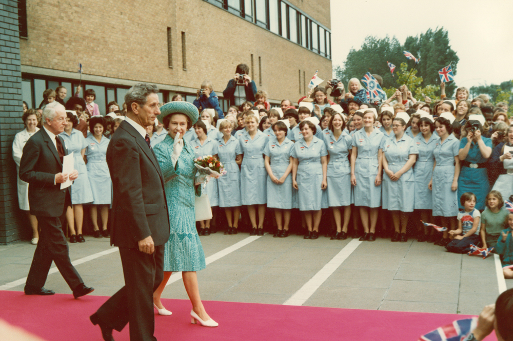 Queen Elizabeth II leaving the Medical School in front of a large group of nurses