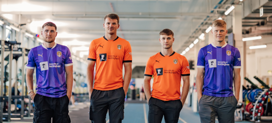 Academy players lined up for portrait in gym