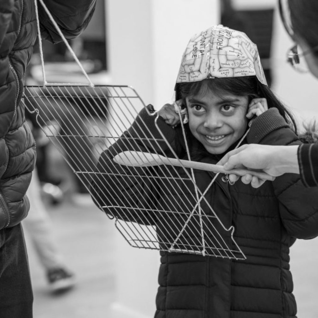 Child at the Festival of Science doing an experiment