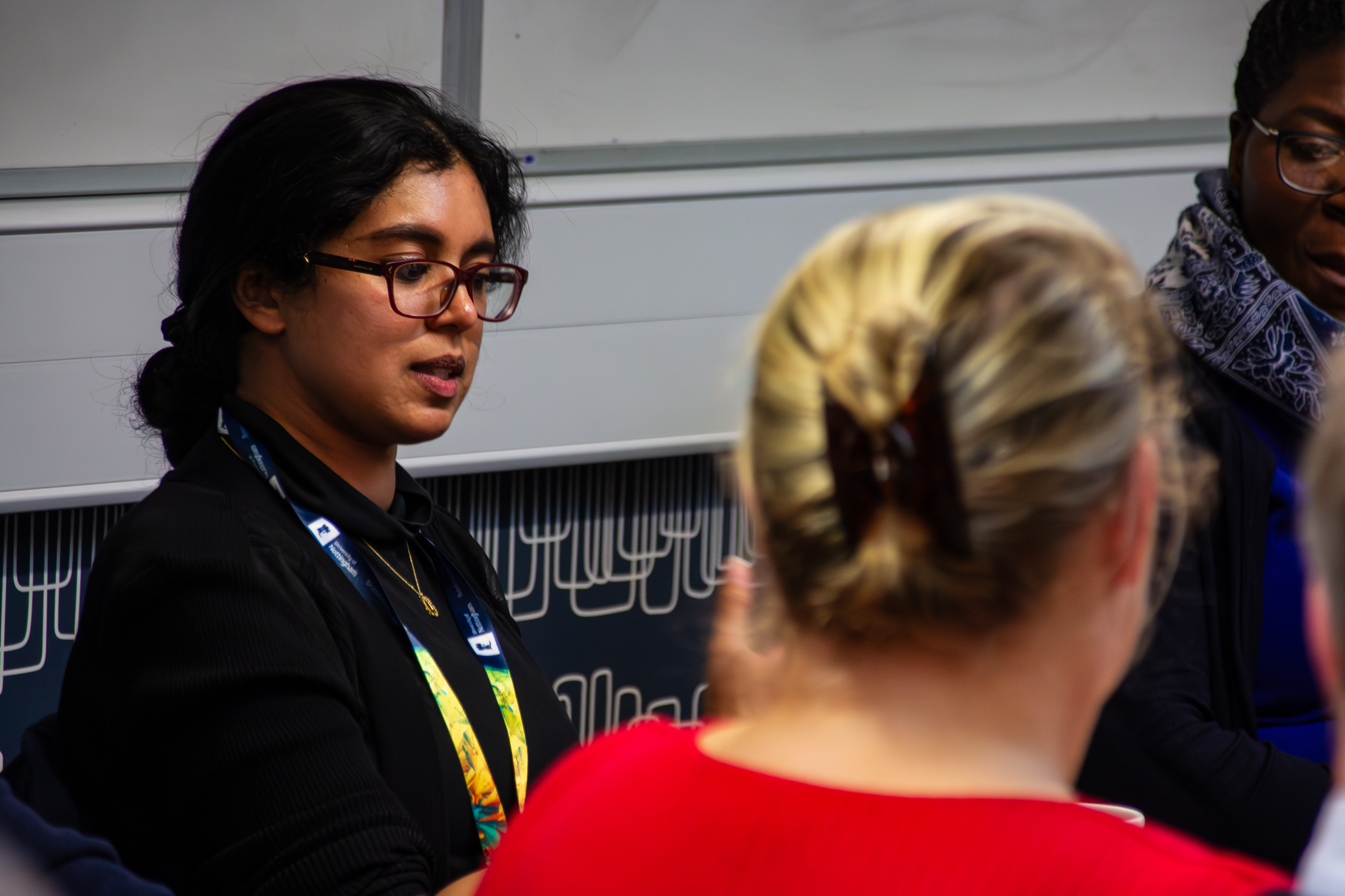 Researcher talking to colleagues